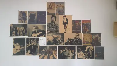a collage of photos on a wall at Oneone eleven hostel in Belgrade