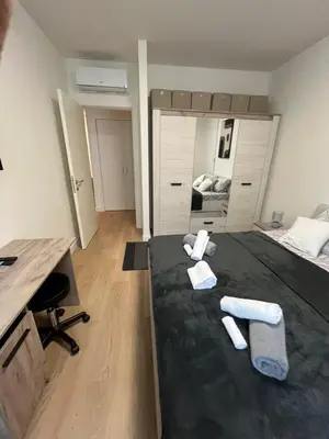 a room with a bed with two towels on it at Belgrade Waterfront - Free Parking - Echo in Belgrade