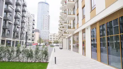 a street in a city with tall buildings at Belgrade Waterfront - Free Parking - Echo in Belgrade