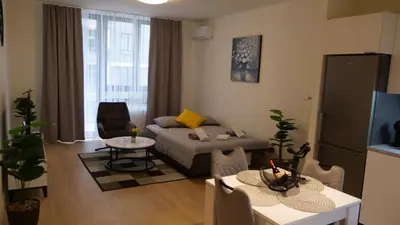 a living room with a couch and a table at Belgrade Waterfront - Free Parking - Echo in Belgrade