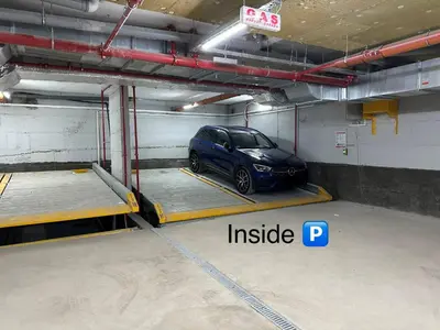 a car is parked in a parking garage at Apartment 6 Belgrade in Belgrade