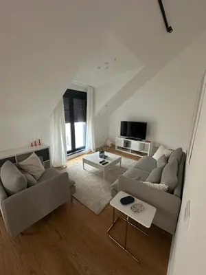 a living room with two couches and a table at Apartment 6 Belgrade in Belgrade