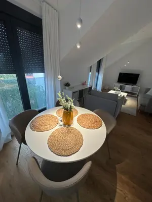 a white table and chairs in a living room at Apartment 6 Belgrade in Belgrade