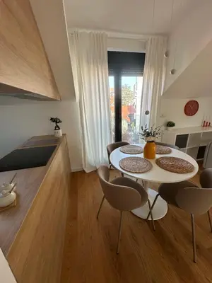 a living room with a white table and chairs at Apartment 6 Belgrade in Belgrade