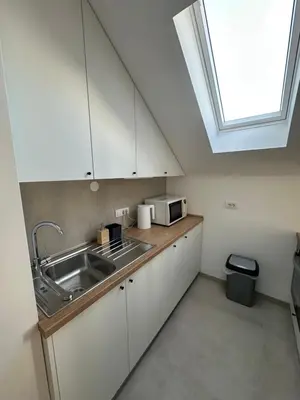 a kitchen with a sink and a window at Apartment 6 Belgrade in Belgrade