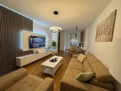 a living room with a couch and a table at La Homa LUX in Pančevo