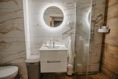 a bathroom with a sink and a mirror at La Homa LUX in Pančevo