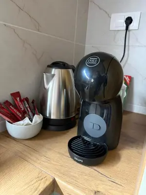 a coffee maker sitting on top of a counter at Fagus apartments in Arandjelovac
