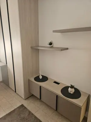 a room with a desk with a plant on it at Miss Extra LuX in Mladenovac