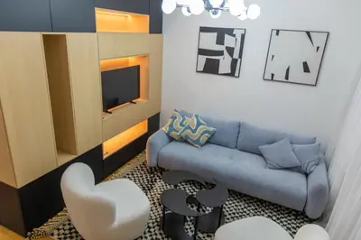 a living room with a couch and a tv at lux Apartman lazar in Pančevo