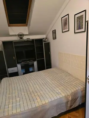 a bedroom with a bed in a room at Apartman Laki 56 in Kalugjerica