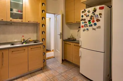 a kitchen with a refrigerator with magnets on it at Echo Arena in Belgrade