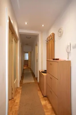 a hallway of a home with a long hall with cabinets at Echo Arena in Belgrade