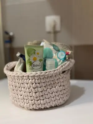 a basket filled with bathroom items on a table at Kutak mira in Belgrade