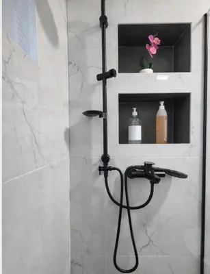 a shower with a hose in a bathroom at AeroLux Apartments-Surčin, Near Belgrade Airport in Surčin