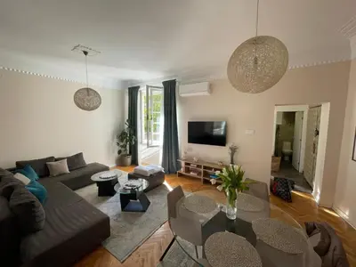 a living room with a couch and a table at Central Harmony Apartments in Belgrade