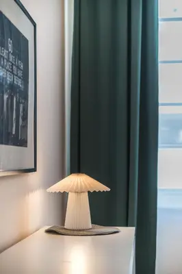 a mushroom lamp sitting on top of a table at Central Harmony Apartments 1 in Belgrade