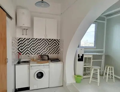 a kitchen with a washer and dryer in a room at apartment on top of the city in Belgrade