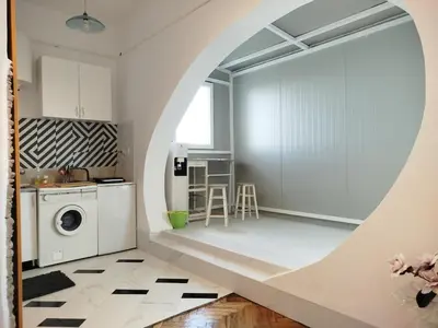 a kitchen with a washer and dryer in a room at apartment on top of the city in Belgrade