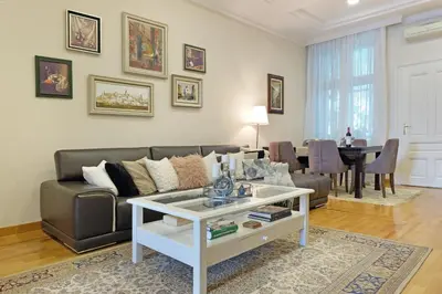 a living room with a couch and a table at Ambasador&Luxury Downtown apartment in Belgrade