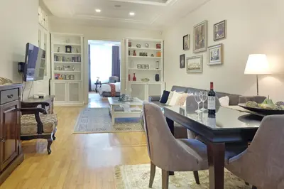 a living room with a table and a couch at Ambasador&Luxury Downtown apartment in Belgrade