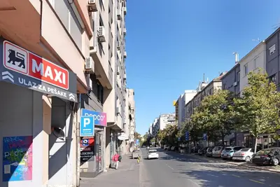 a city street with cars parked on the street at Ambasador&Luxury Downtown apartment in Belgrade