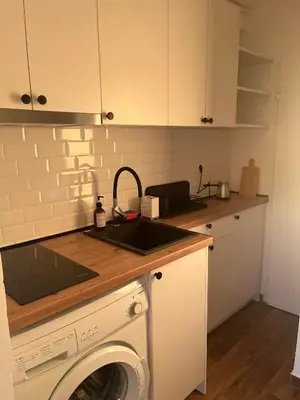 a kitchen with a sink and a washing machine at SKY NEST - Small Studio, Grand View in Belgrade