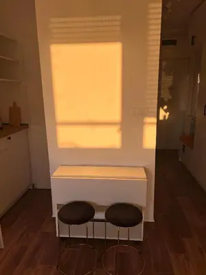 two stools sitting under a counter in a kitchen at SKY NEST - Small Studio, Grand View in Belgrade