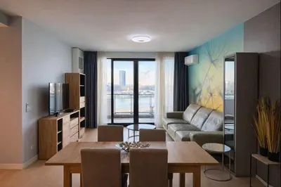 a living room with a couch and a table at Belgrade Waterfront - River Residences in Belgrade