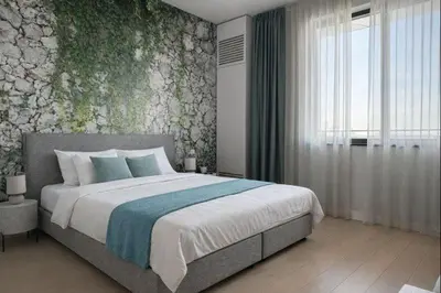 a bedroom with a large bed with a floral wall at Belgrade Waterfront - River Residences in Belgrade