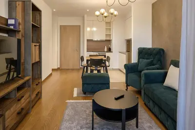 a living room with a couch and a table at Belgrade Waterfront - River Residences in Belgrade
