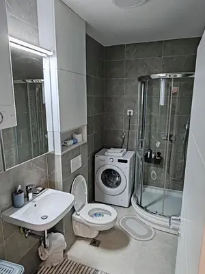 a bathroom with a shower toilet and a sink at Lux Star Belgrade in Belgrade