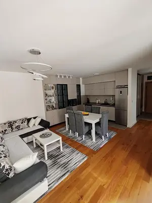 a living room with a couch and a table at Lux Star Belgrade in Belgrade