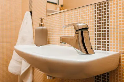 a sink with a faucet in a bathroom at Indigo Spirit with Terrace & Foosball Old Town in Belgrade