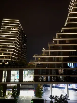 two tall buildings in a city at night at BW Maša in Belgrade