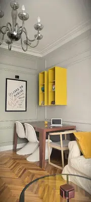 a living room with a table and a couch at Apartment JADesign Vračar, Belgrade in Belgrade