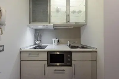 a kitchen with a sink and a microwave at Square 19 in Belgrade
