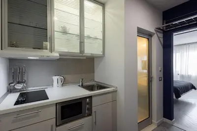 a kitchen with a sink and a counter top at Square 19 in Belgrade