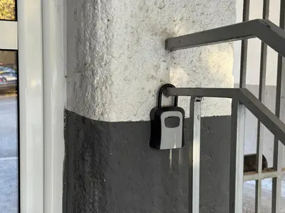 a cell phone holder on a wall next to a door at Anywhere on Foot - FREE Parking in Belgrade