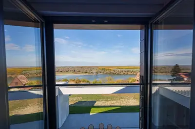 a window view of a river from a house at Istros luxury house in Krčedin