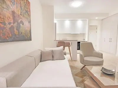 a living room with a couch and a chair at Metropoliten - Aria Lux Apartments BW in Belgrade