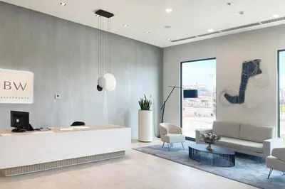 a lobby with a reception desk and a guitar on the wall at Metropoliten - Aria Lux Apartments BW in Belgrade