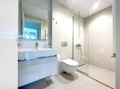 a white bathroom with a sink and a toilet at Simphonia Lux Apartments BW in Belgrade