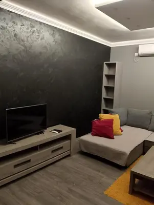 a living room with a couch and a flat screen tv at Central Point Belgrade in Belgrade