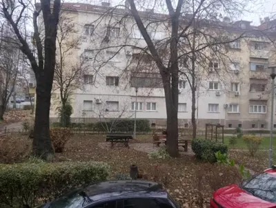 a building with a car parked in front of it at Central Point Belgrade in Belgrade