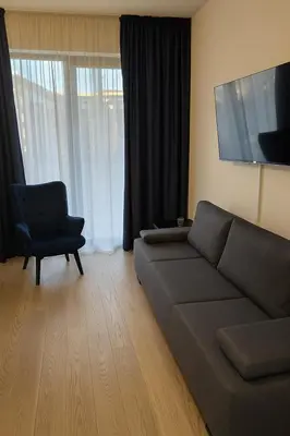 a living room with a couch and a chair at Waterfront Studio Blue Lagoon in Belgrade