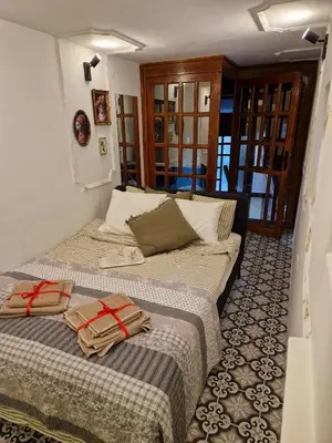 two beds sitting next to each other in a room at Gallery House in Belgrade