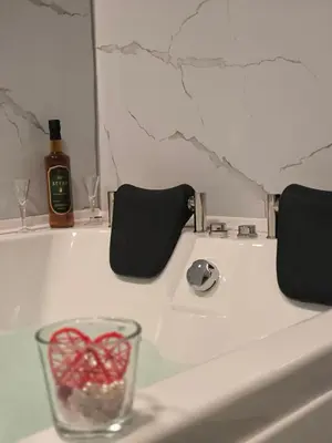 a bathroom sink with a glass bowl with a heart in it at Sunset in Pančevo