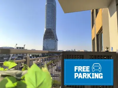 a sign that reads free parking in front of a building at Gallery Mall View-studio in Belgrade