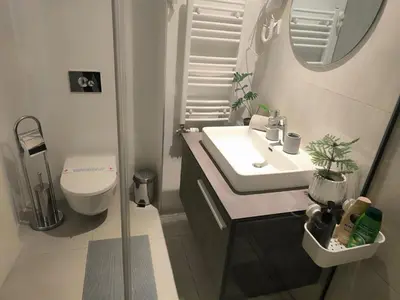 a small bathroom with a sink and a toilet at Gallery Mall View-studio in Belgrade